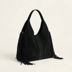 Black fringe studded bag, three-quarter angle showing side depth