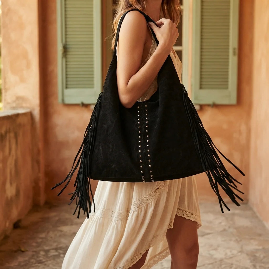 Woman wearing Black fringe studded bag with swaying fringe