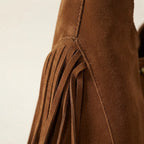 Close-up of fringe stitching and texture on Brown fringe studded bag