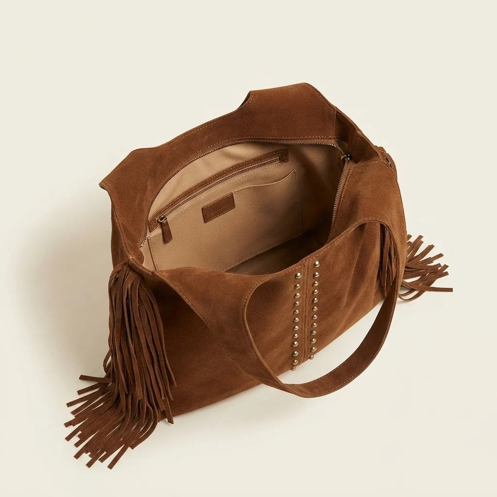 Interior lining and pockets of Brown fringe studded bag