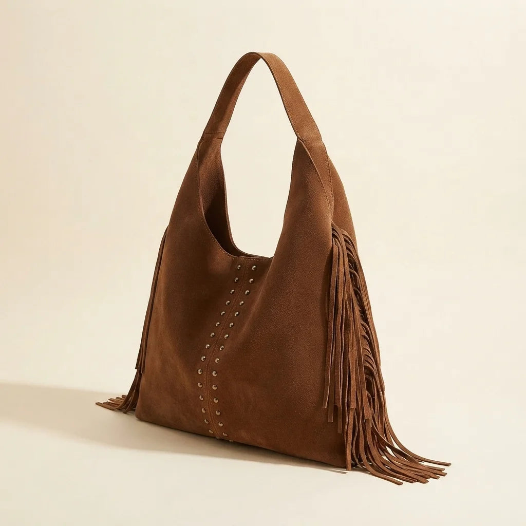 Brown fringe studded bag, three-quarter angle showing side depth
