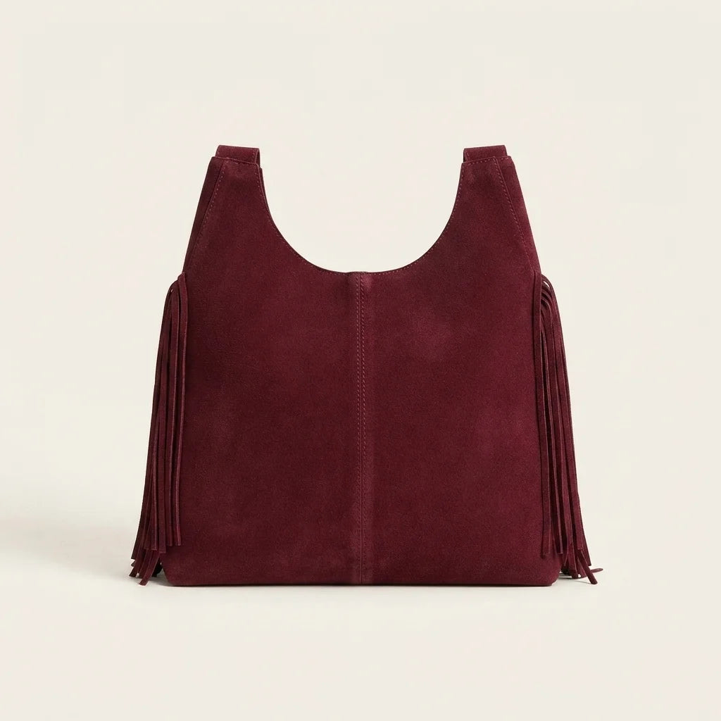 Back panel of Burgundy fringe studded bag with strap attachments