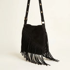 Black fringe suede belt bag, three-quarter angle showing side depth
