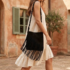 Woman wearing Black fringe suede belt bag with swaying fringe