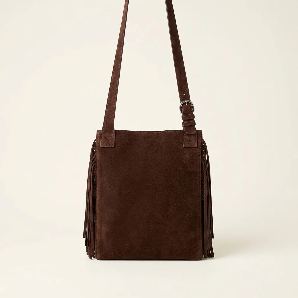 Back panel of Brown fringe suede belt bag with strap attachments
