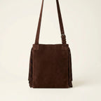 Back panel of Brown fringe suede belt bag with strap attachments