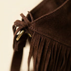 Close-up of fringe stitching and texture on Brown fringe suede belt bag