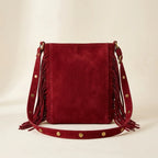 Back panel of Red fringe suede belt bag with strap attachments