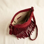 Interior lining and pockets of Red fringe suede belt bag