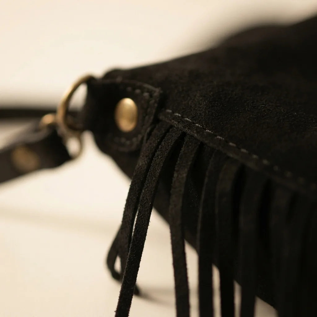 Close-up of fringe stitching and texture on Black fringe tassel crossbody bag