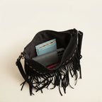 Interior lining and pockets of Black fringe tassel crossbody bag