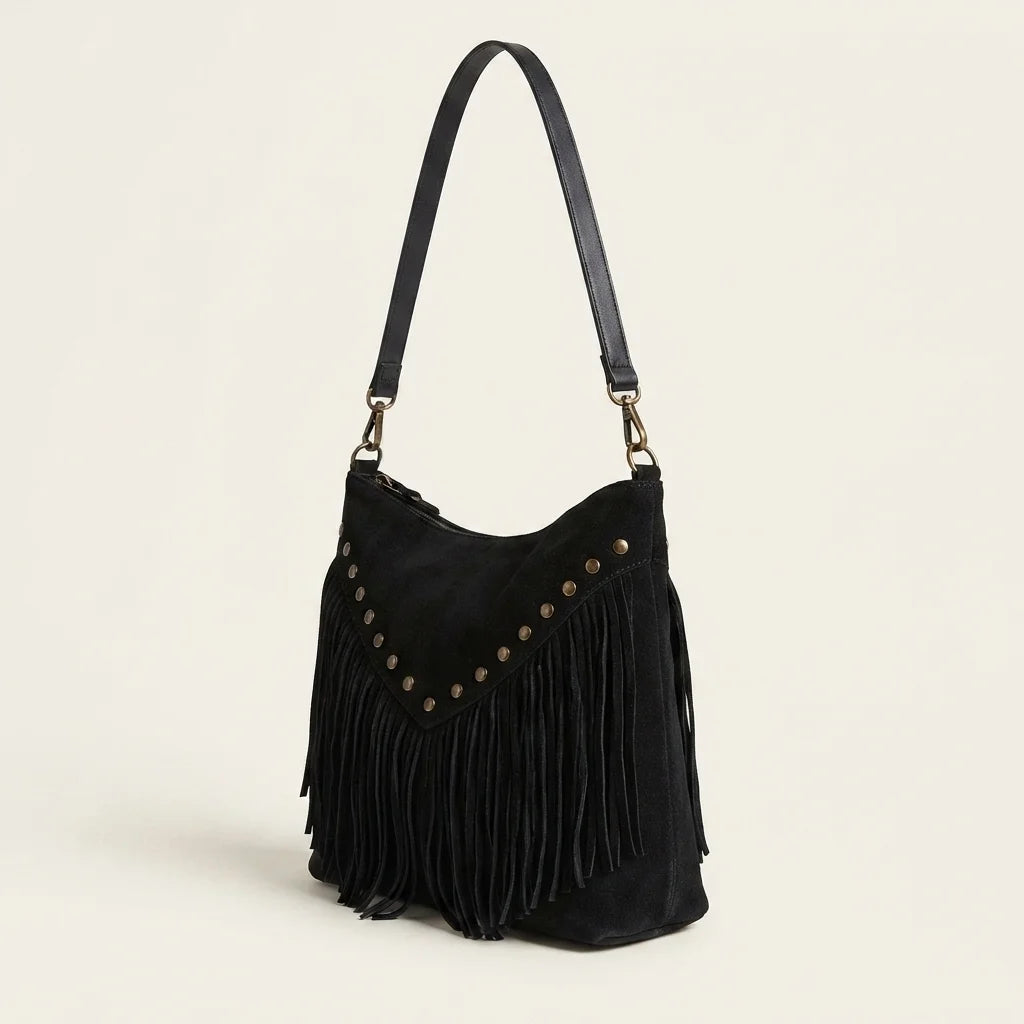 Black fringe tassel crossbody bag, three-quarter angle showing side depth