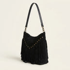 Black fringe tassel crossbody bag, three-quarter angle showing side depth