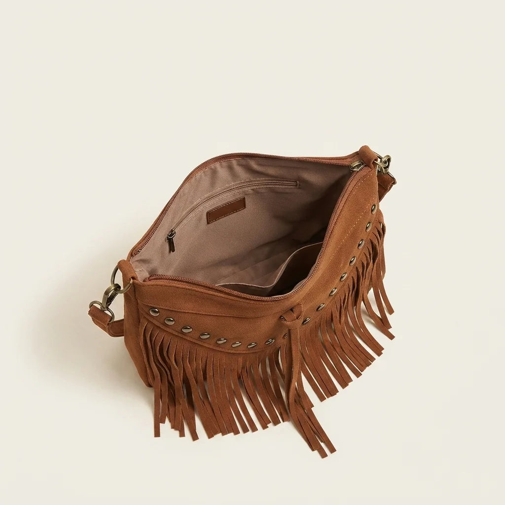 Interior lining and pockets of Brown fringe tassel crossbody bag