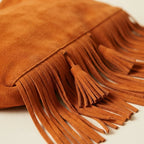 Close-up of fringe stitching and texture on Orange fringe tassel shoulder bag