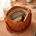 Interior lining and pockets of Orange fringe tassel shoulder bag