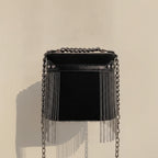 Back panel of Black fringe tassel small bag with strap attachments