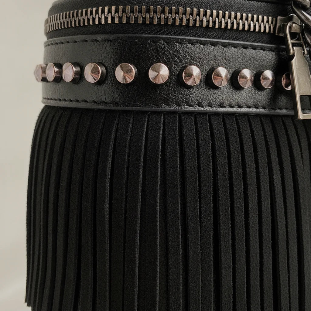 Close-up of fringe stitching and texture on Black fringe tassel small bag