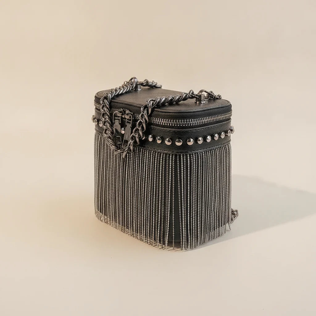 Black fringe tassel small bag, three-quarter angle showing side depth