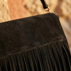 Close-up of fringe stitching and texture on black fringed-shoulder-bag-black-and-white