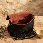 Interior lining and pockets of black fringed-shoulder-bag-black-and-white