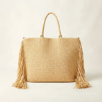 Back panel of Natural fringed straw tote bag with strap attachments