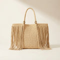 Natural fringed straw tote bag, front view