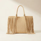 Natural fringed straw tote bag, front view