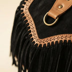 Close-up of fringe stitching and texture on Black fringed suede sling bag