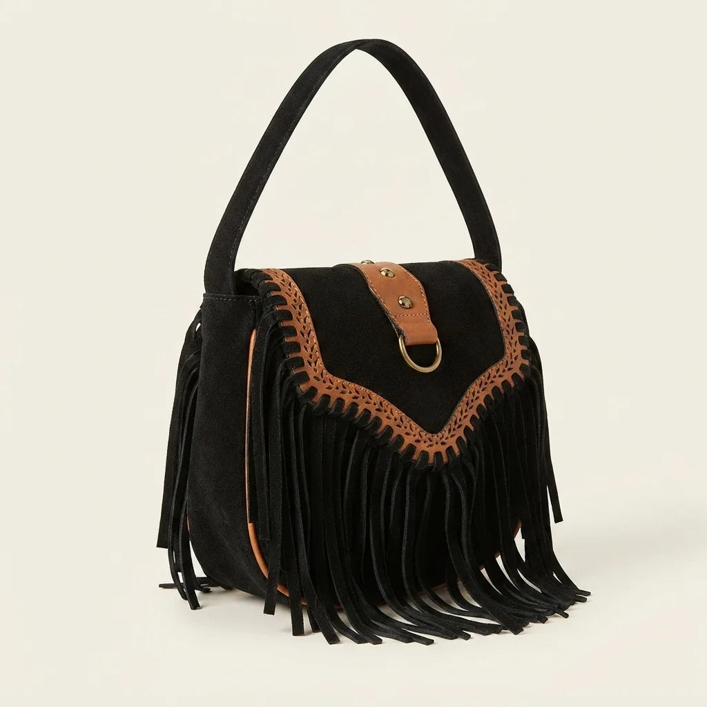 Black fringed suede sling bag, three-quarter angle showing side depth