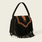 Black fringed suede sling bag, three-quarter angle showing side depth