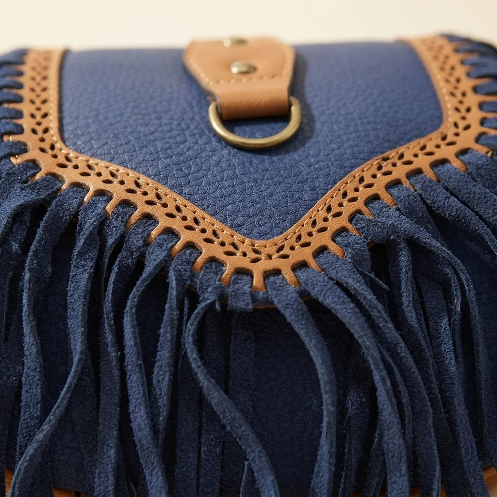 Close-up of fringe stitching and texture on Blue fringed suede sling bag