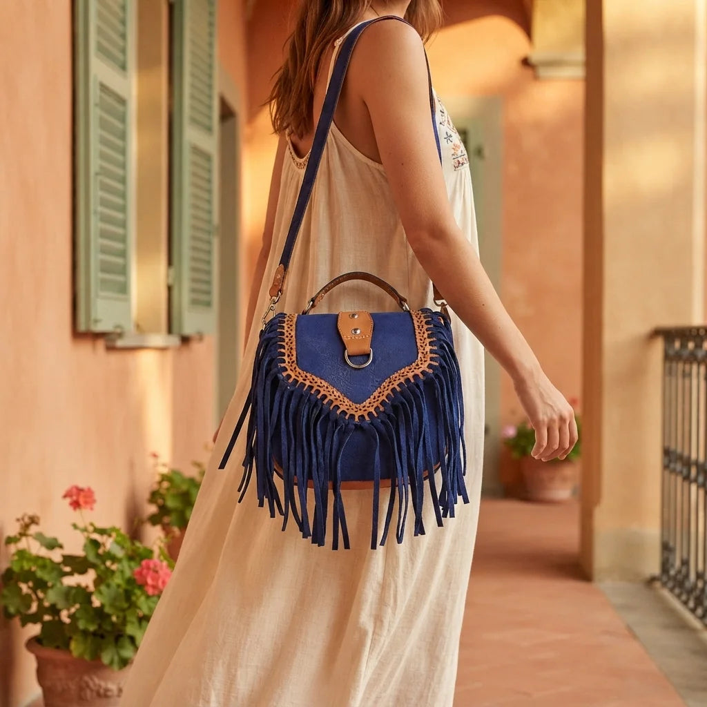 Woman wearing Blue fringed suede sling bag with swaying fringe