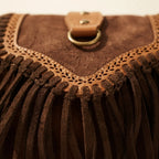 Close-up of fringe stitching and texture on Brown fringed suede sling bag