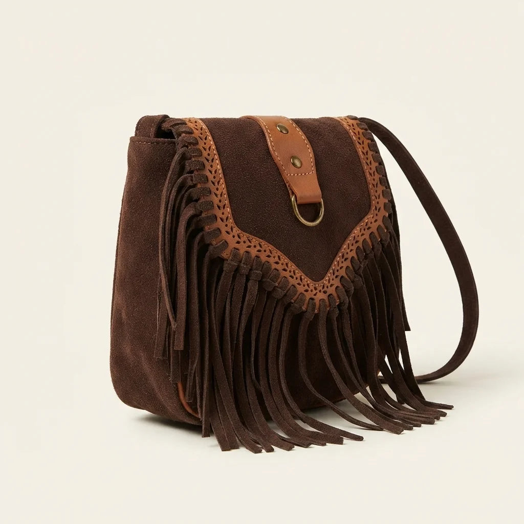 Brown fringed suede sling bag, three-quarter angle showing side depth
