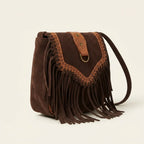 Brown fringed suede sling bag, three-quarter angle showing side depth