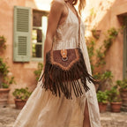 Woman wearing Brown fringed suede sling bag with swaying fringe