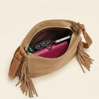 Interior lining and pockets of Camel fringed suede sling bag