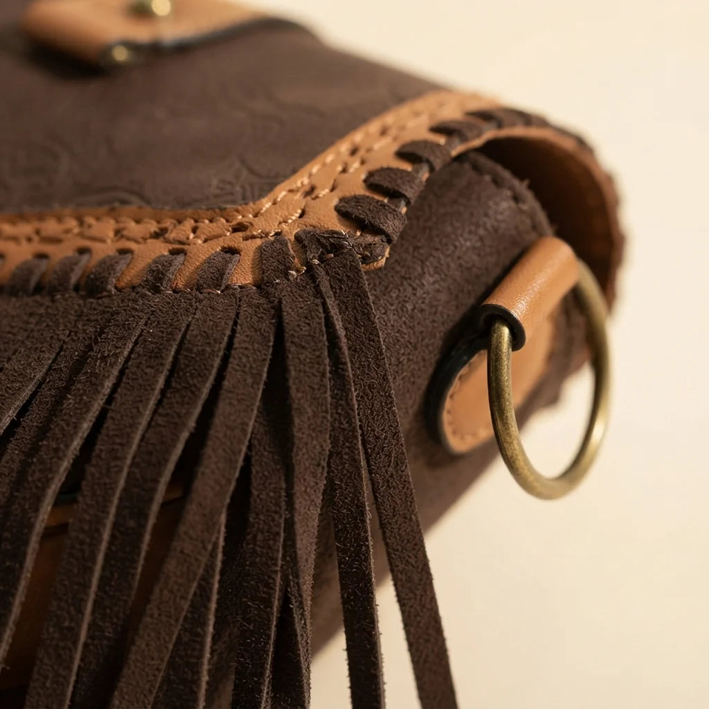 Close-up of fringe stitching and texture on Dark Brown fringed suede sling bag