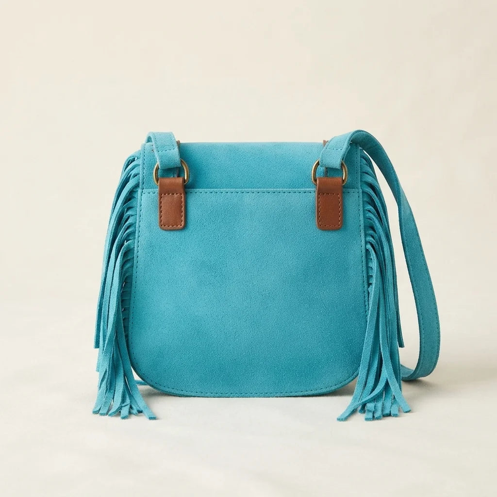 Back panel of Turquoise fringed suede sling bag with strap attachments