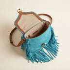 Interior lining and pockets of Turquoise fringed suede sling bag
