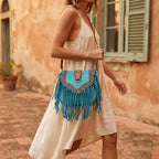 Woman wearing Turquoise fringed suede sling bag with swaying fringe