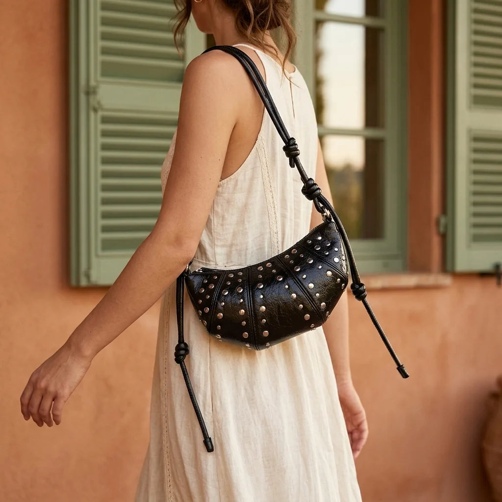Woman wearing Black genuine leather fringe bag with swaying fringe