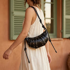 Woman wearing Black genuine leather fringe bag with swaying fringe
