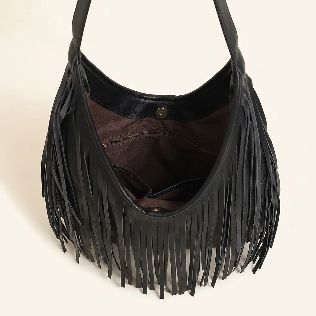 Interior lining and pockets of Black genuine leather fringe hobo bag