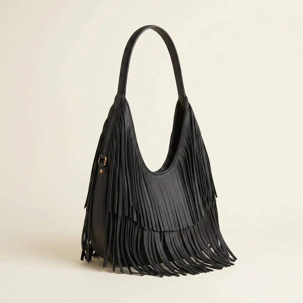 Black genuine leather fringe hobo bag, three-quarter angle showing side depth