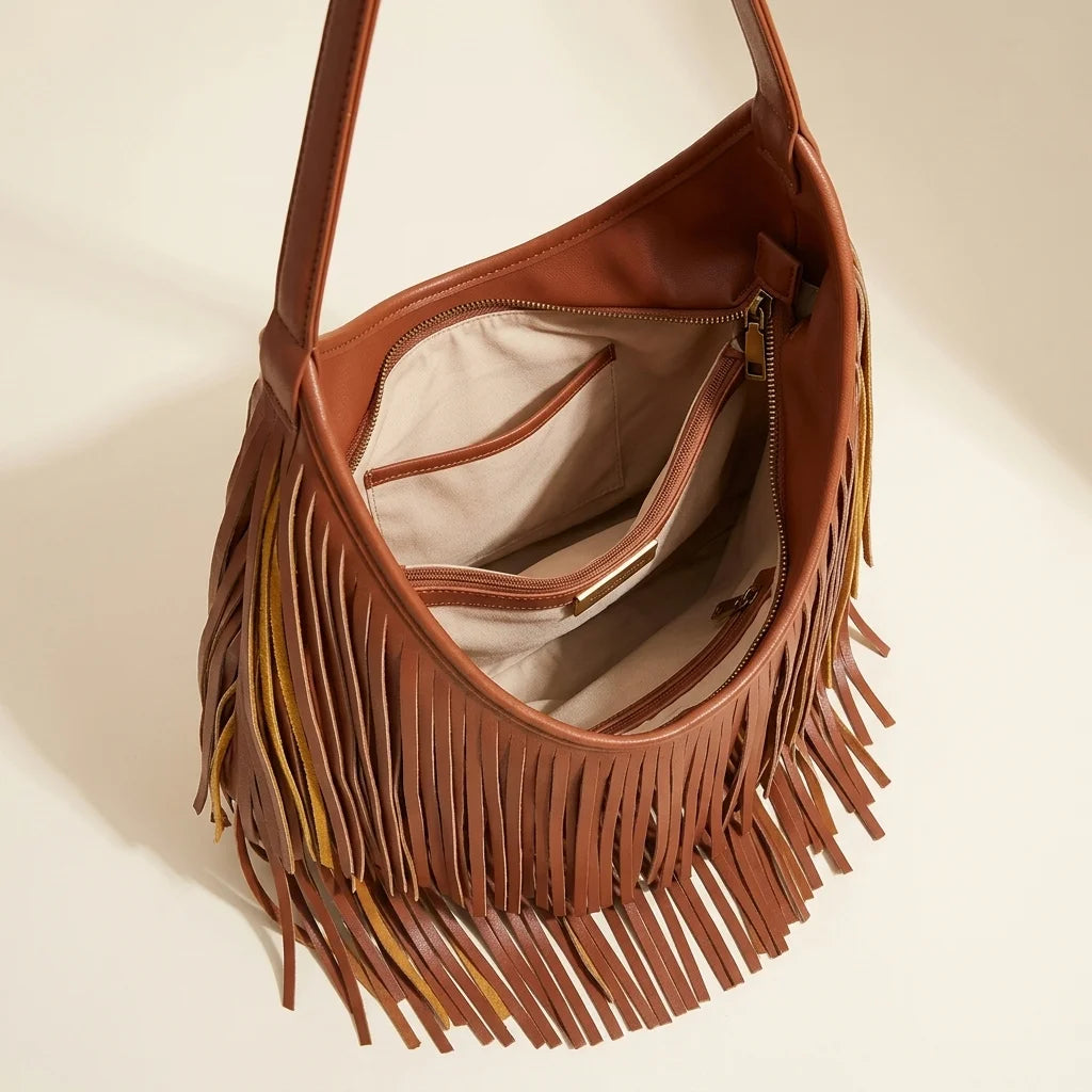 Interior lining and pockets of Brown genuine leather fringe hobo bag