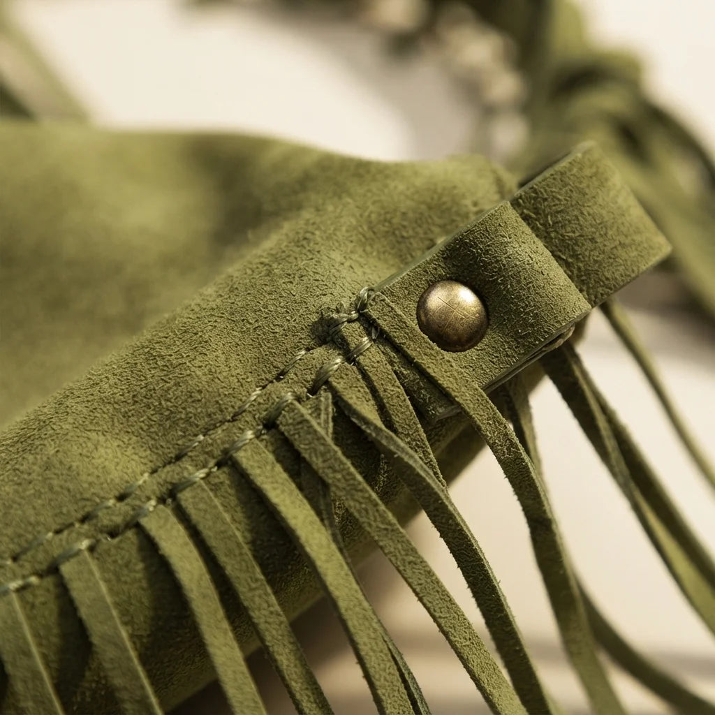 Close-up of fringe stitching and texture on Green green fringe bag