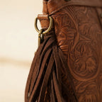 Close-up of fringe stitching and texture on Coffee handcrafted leather fringe crossbody bag