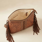 Interior lining and pockets of Coffee handcrafted leather fringe crossbody bag